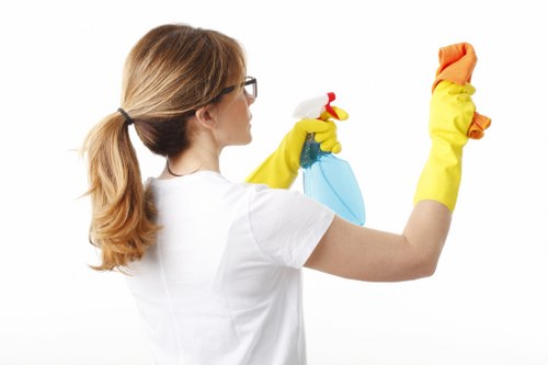 Cleaner preparing a tidy living space in Kingston upon Thames